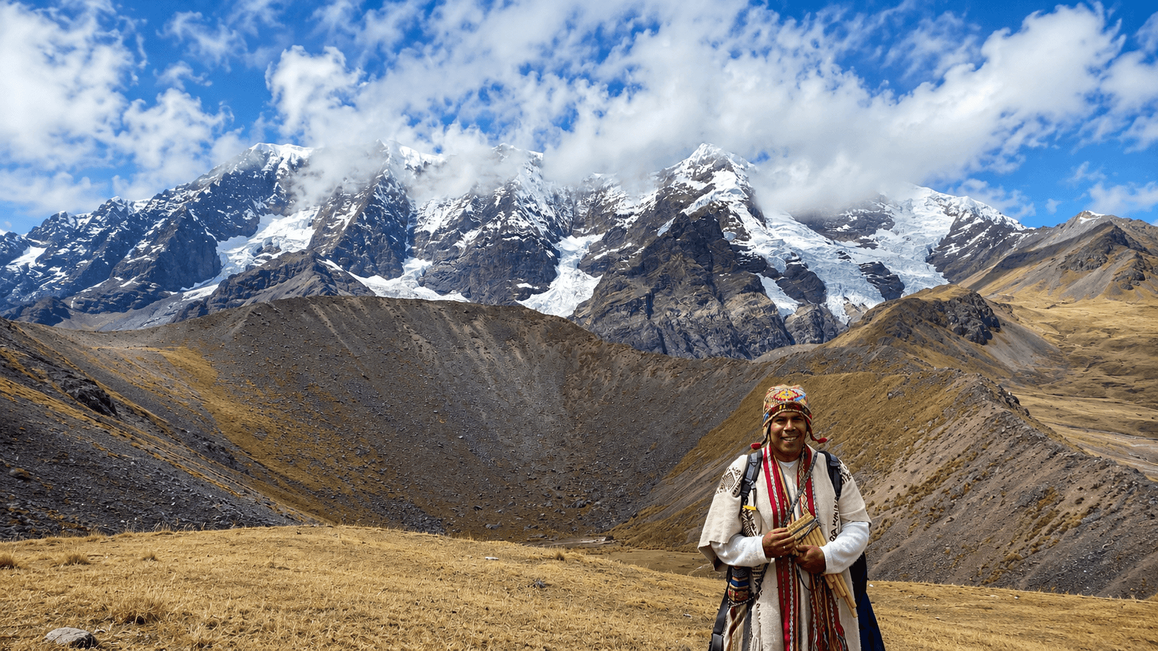 Paqo of the Andes before the sacred mountain Ausangate, Peru